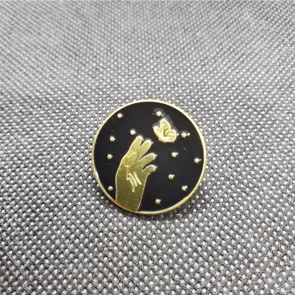 Simple hand and butterfly gold enamel pin. enamel pin
